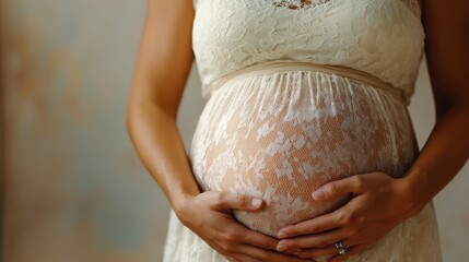 The image captures a graceful maternity moment as a woman in a delicate lace dress lovingly holds her belly, radiating warmth and embracing motherhood.