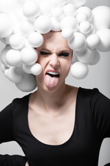 Beauty, make-up and style concept. Stylish beautiful young woman wearing a white unique made of...