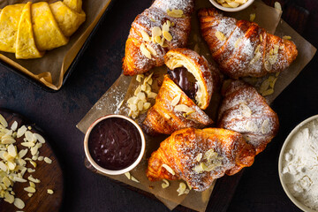 Chocolate croissants on a dark background top view