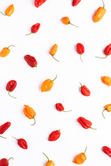 Seamless pattern with colorful Habanero peppers on white background top view. Vertical image.