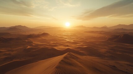 Naklejka premium A panoramic view of a desert landscape at sunset with the sun setting behind the distant mountains.