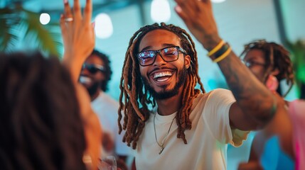 Obraz premium A man with dreadlocks gives a high five to a woman at a party.