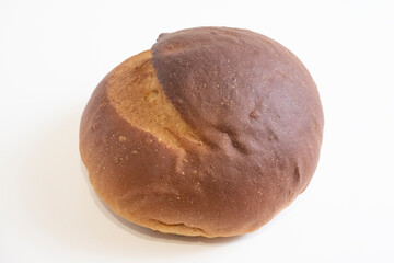 Fresh crispy bread on a white background. Front view