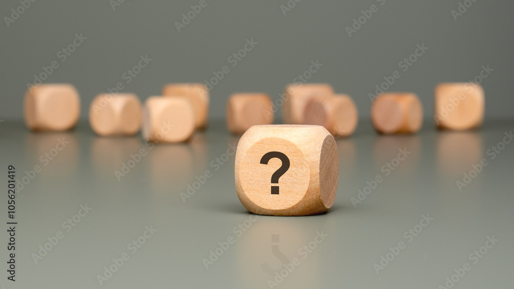 Poster intriguing wooden blocks featuring the symbol of a question mark for all to explore