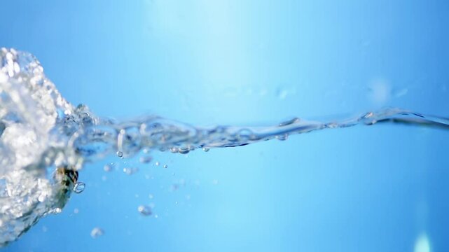 Mesmerizing close-up of blue water waves in slow motion, showcasing the purity and freshness of drinking water for hydration themes.