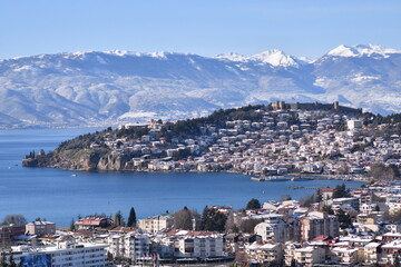 View of city of Ohrid in the winter from the hill.  Ohrid is a Macedonian resort and tourist destination. A view of the old part of the city and the Samoil fortress, in the distance Jablanica mountain
