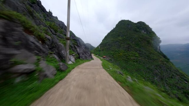 POV Of Scooter Riding On Dangerous Narrow Road At Ha Giang Loop, Fell Down The Roadside In Vietnam. tracking shot