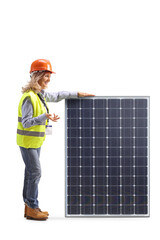 Female engineer standing next to a solar panel and talking