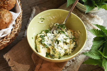 Nettle butter in a green bowl - bread spread made of wild edible plants