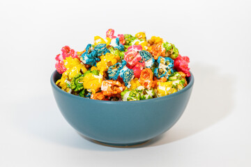 Colorful popcorn in a blue bowl, vibrant and tasty for events and snacks.