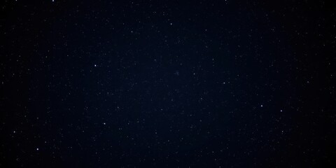 Fototapeta premium Starry night sky with twinkling stars on dark background, magical, space