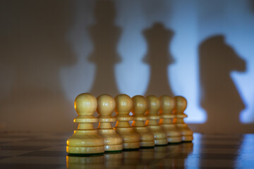 Chess pieces symbolize geopolitical and social relations. Their positions and shadows allow viewers...