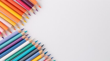 Fototapeta premium Colorful pencils arranged on white background with ample copy space, ideal for art projects, stationery designs, back-to-school themes, and creative layouts.