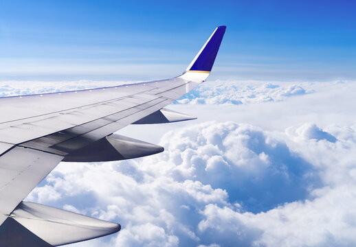 view from airplane window cloud blue sky plane