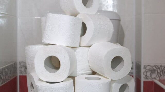 Storage with white rolling paper. A storage of rolling recycling papers on the toilet bowl in the new nice bath.