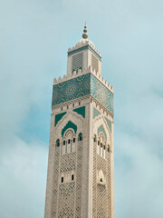 Fototapeta premium view of the famous Hassan II Mosque Minaret against blue sky - Casablanca, Morocco