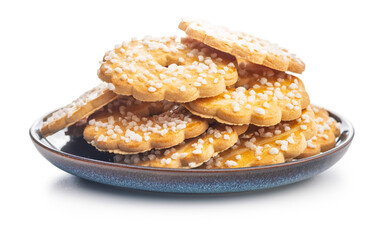 Sweet cookies in the shape of a flower. Tasty biscuits on plate isolated on white background.