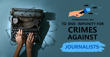 Female hands with vintage typewriter and barbed wire on blue background. Printing ban concept