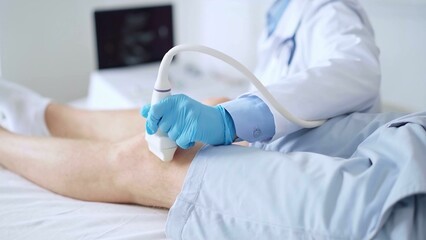Doctor woman wearing blue medical gloves performing knee ultrasound exam on male patient with shorts . Medicine, orthopedic service concept