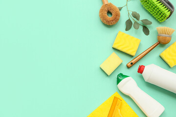 Composition with natural cleaning supplies on turquoise background