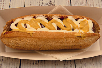 German immigrants brought them to the United States, where they quickly became popular at street stalls and sporting events.