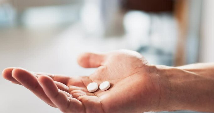 Person, hand and pills for health in home, antibiotics and supplement treatment for cold or flu. Palm, medication and closeup of tablets for tremor disease, seizure drugs and pharmaceutical help