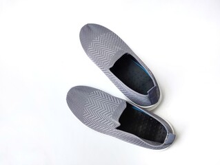 Grey slip-on sneakers for casual wear isolated on white background 
