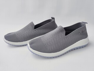 Grey slip-on sneakers for casual wear isolated on white background 