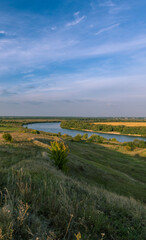 Naklejka premium A beautiful landscape with a river and a hillside