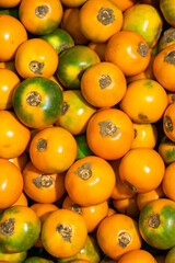Solanum quitoense - Naranjilla tropical fruit in Colombian market square
