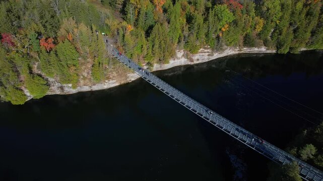 Aerial view from above at Ranney Gorge Suspension Bridge in Campbellford, part of the Great Trail. Longest recreational trail in the world. Trent River below and Ranney Falls to the north. Ferris Park
