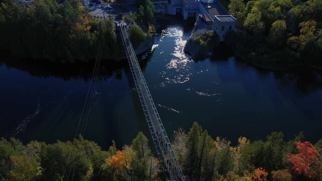 Aerial view from above at Ranney Gorge Suspension Bridge in Campbellford, part of the Great Trail. Longest recreational trail in the world. Trent River below and Ranney Falls to the north. Ferris Park