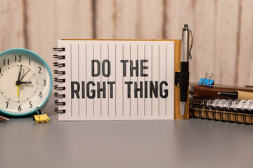 do the right thing. text on torn paper on white backing