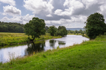 Walking along the river Wharfe in the Yorkshire dales, England, in summer