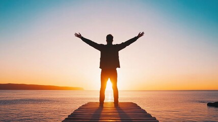 Fototapeta premium Silhouette of person with arms raised at sunset by ocean, feeling empowered