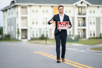 Businessman buying and selling houses and real estate. real state agent giving new house key. Estate agent with customer before contract signature. male real state agent with a for sale or rent sign.