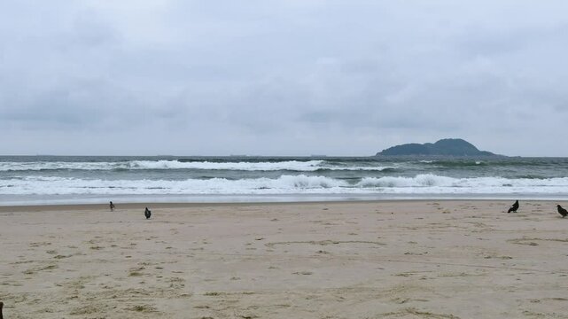 Time lapse at the Tombo beach of Guaruja - SP, Brazil with the Farol da Moela island on background.