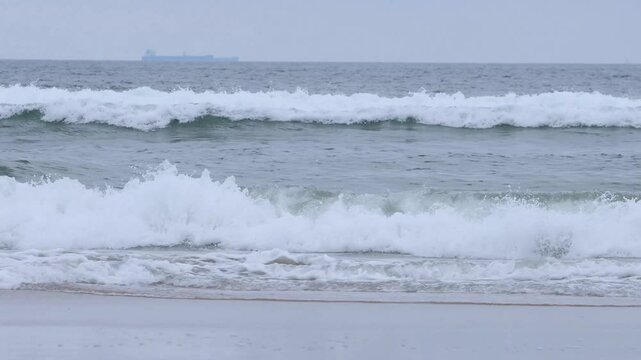 Rough sea at the Tombo beach of Guaruja - SP, Brazil. Beach of the coast of S&atilde;o Paulo state.
