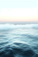 Fototapeta premium A tranquil seascape featuring gentle waves under a soft pastel sky, evoking a serene and peaceful mood. The blending colors of the horizon create a calming atmosphere.