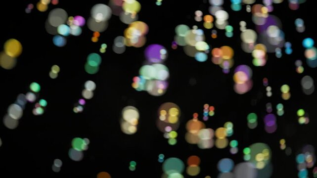 Bokeh background of many falling soap bubbles. Slow motion. 