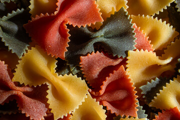 Uncooked Vibrant Colored Farfalle Pasta: A Culinary Canvas of Multicolored Bow-Tie Macaroni,...