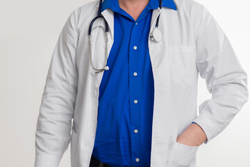 Close-up of doctor in white coat with stethoscope on white background