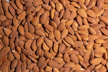 Scattered Almonds. Background from Almond Nuts. Natural High-Calorie Snacks