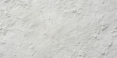A Close-Up View of a Rough White Stucco Wall, Showing the Detailed Texture and Uneven Surface