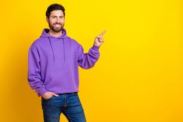Photo portrait of nice young male point empty space dressed stylish violet garment isolated on...