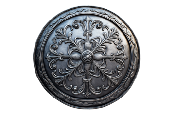 Ornate metal shield with detailed floral engravings isolated on blank background. Elegant antique medieval shield with embossed floral designs.