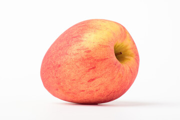 Fresh ripe apple with tiny water drops on white background