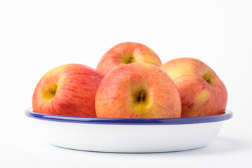 Fresh ripe apple with tiny water drops on white background