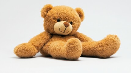Fototapeta premium A small, plush brown teddy bear with a friendly face, resting quietly on a simple background, representing innocence and comfort