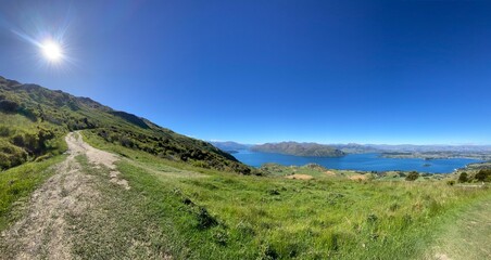 Beautiful landscapes of Lake Wanaka from Mount Roy, Roys Peak, Wanaka, South Island, New Zealand. Landscape with mountains and sky